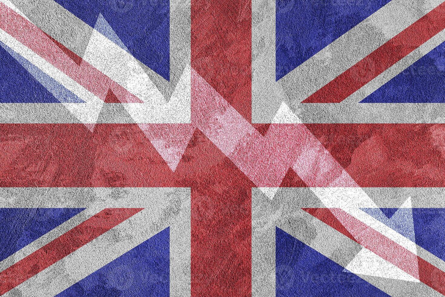 Arrow down on the background of the Great Britain flag. The concept of economic recession, depression and crisis. photo