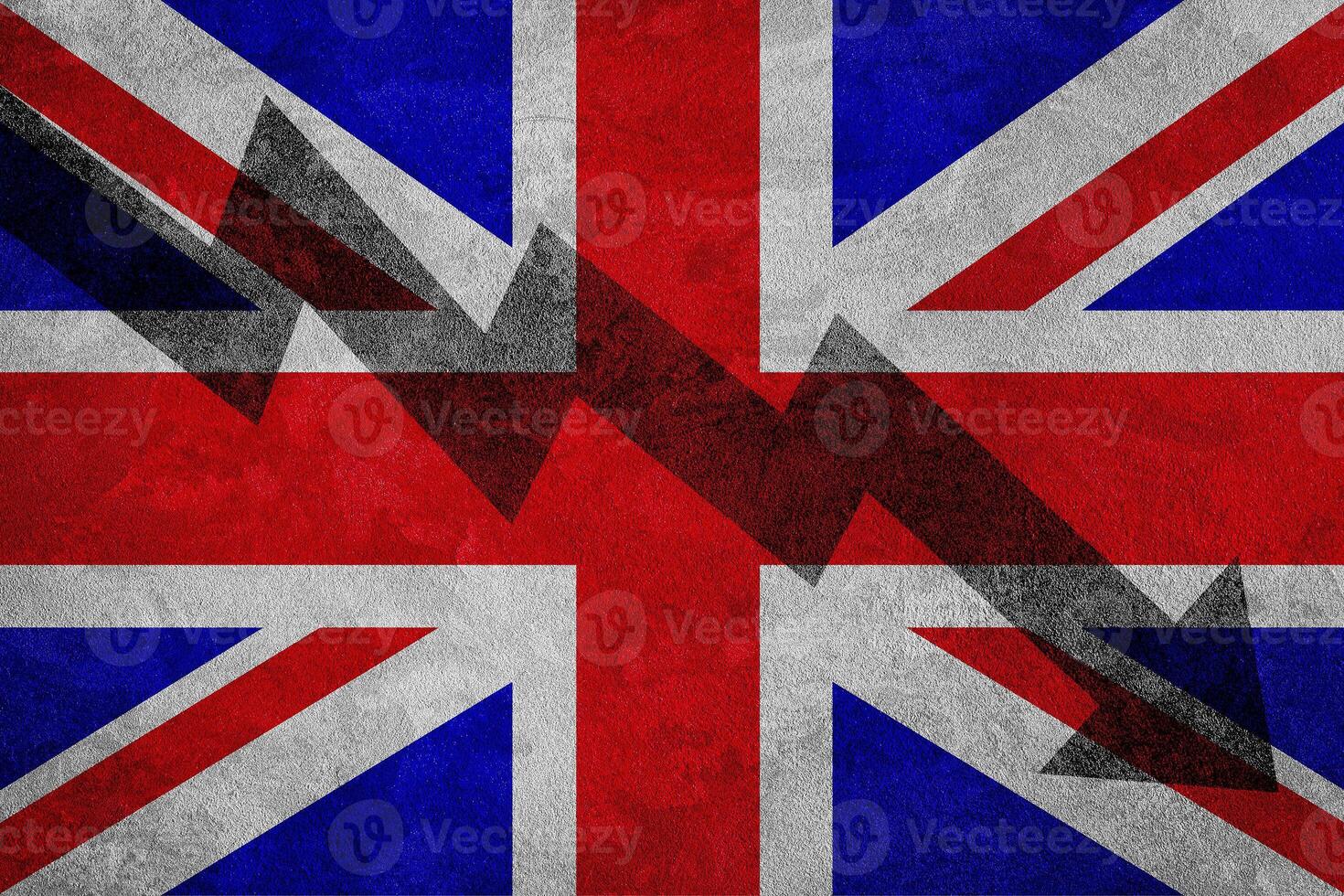 Arrow down on the background of the Great Britain flag. The concept of economic recession, depression and crisis. photo