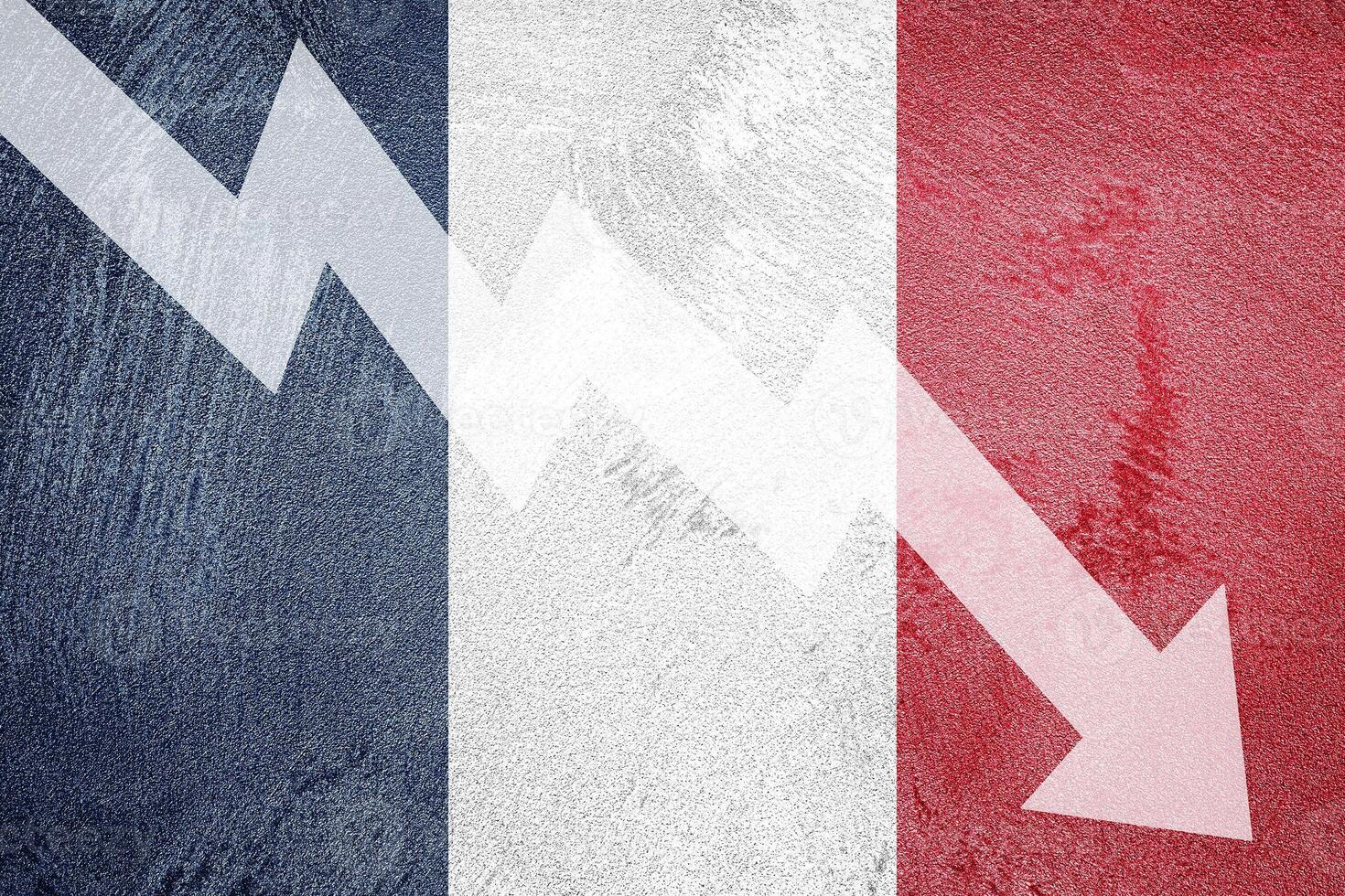 Arrow down on the background of the France flag. The concept of economic recession, depression and crisis. photo
