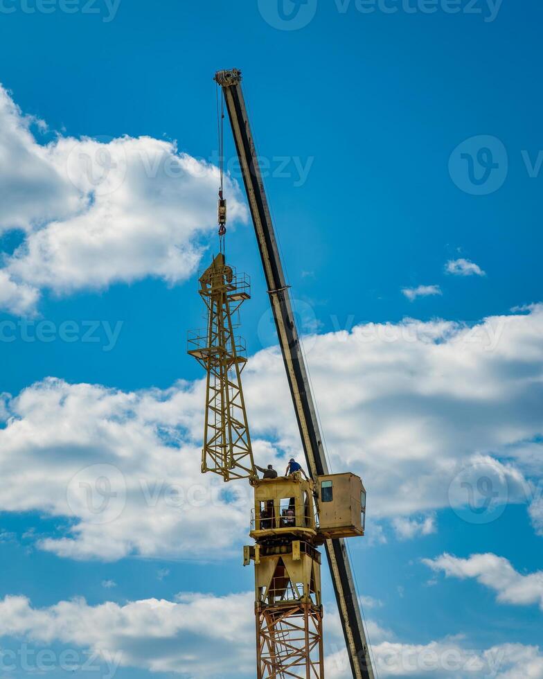 Tower crane assembly. Installation of a construction crane. photo
