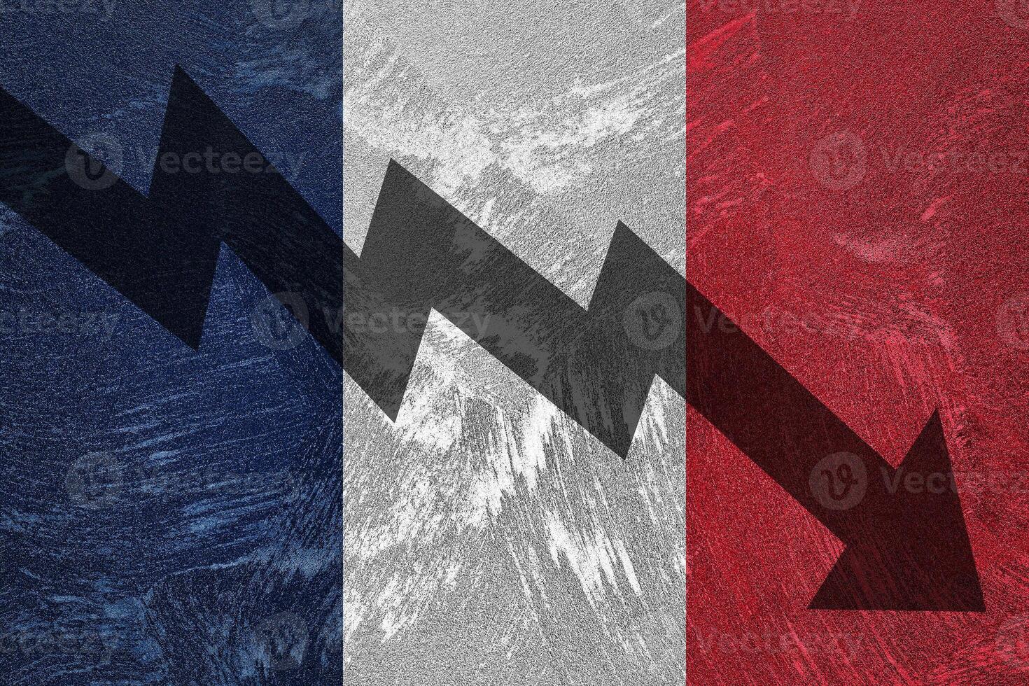 Arrow down on the background of the France flag. The concept of economic recession, depression and crisis. photo