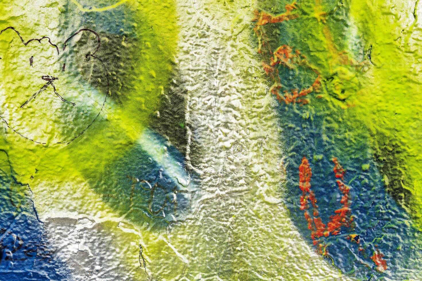 Colorful graffiti painted on a wall. Abstract urban background. Spray painting art. photo