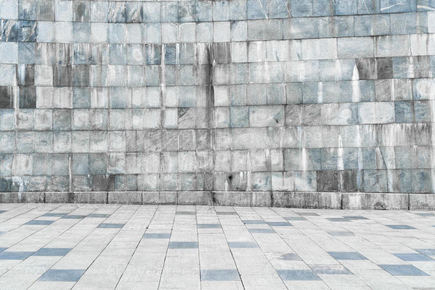 Texture of stone wall covered with tiles and pavement. photo