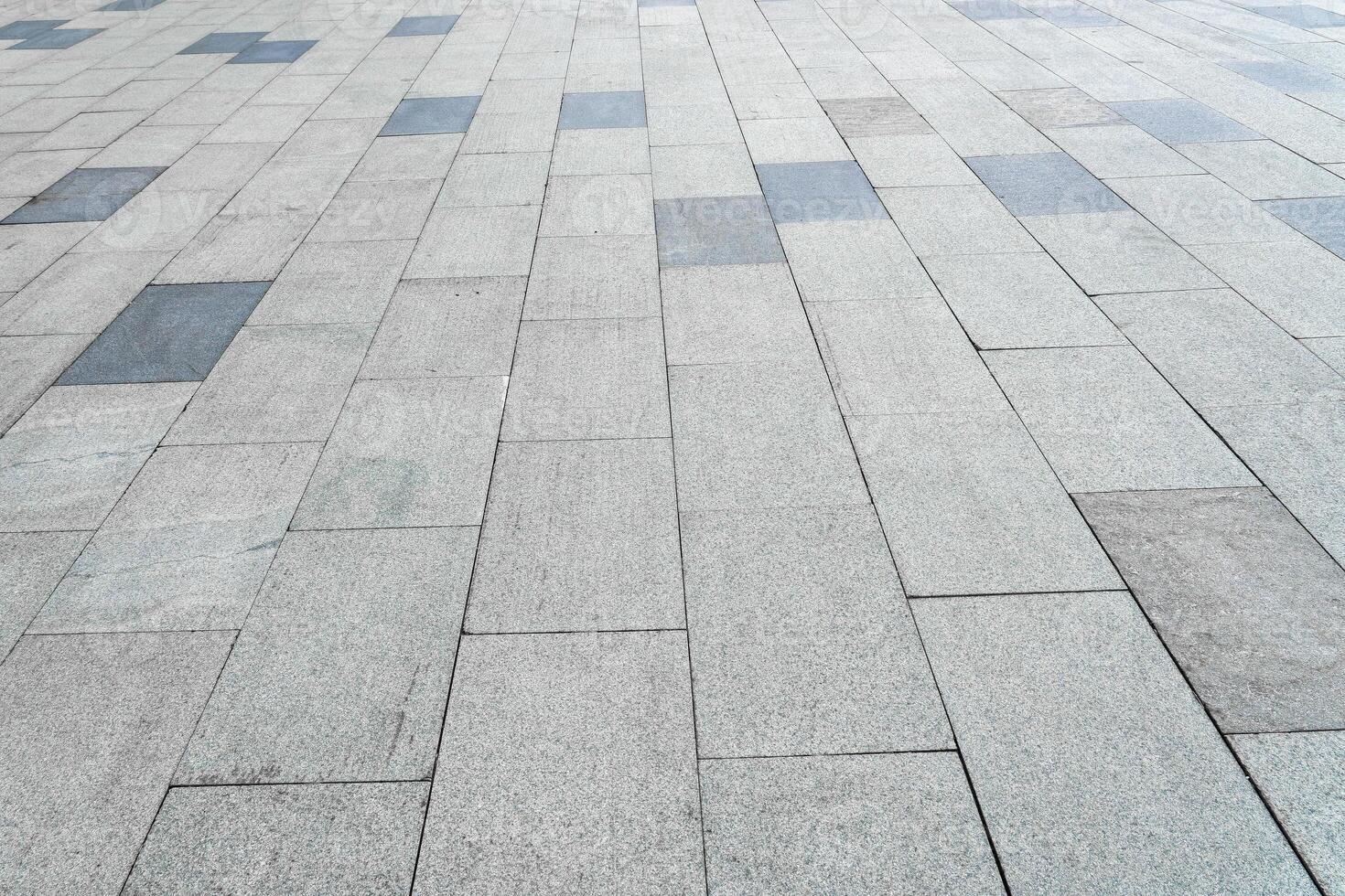 The texture of a tiled pavement with perspective. photo