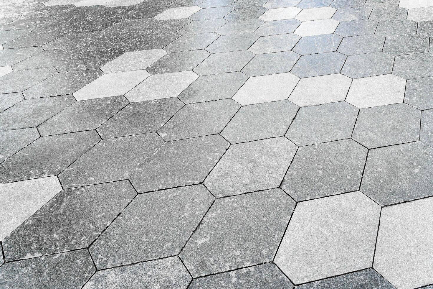The texture of hexagonal tiled pavement with perspective. photo