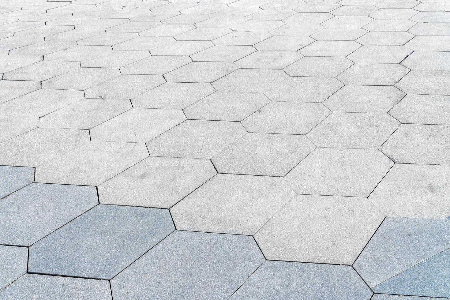 The texture of hexagonal tiled pavement with perspective. photo
