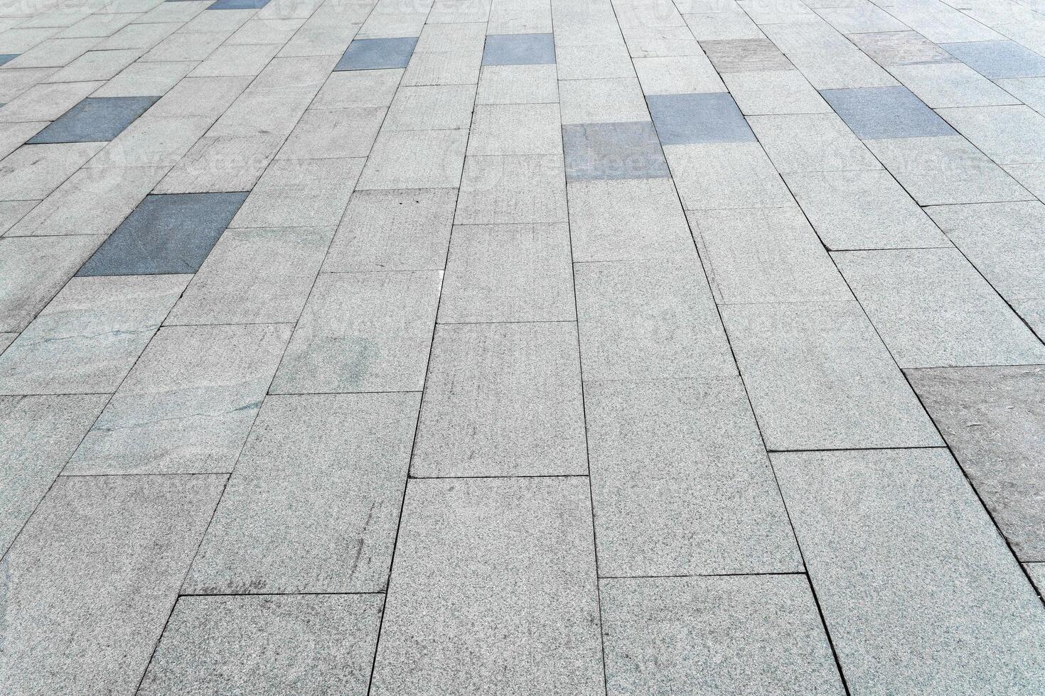 The texture of a tiled pavement with perspective. photo