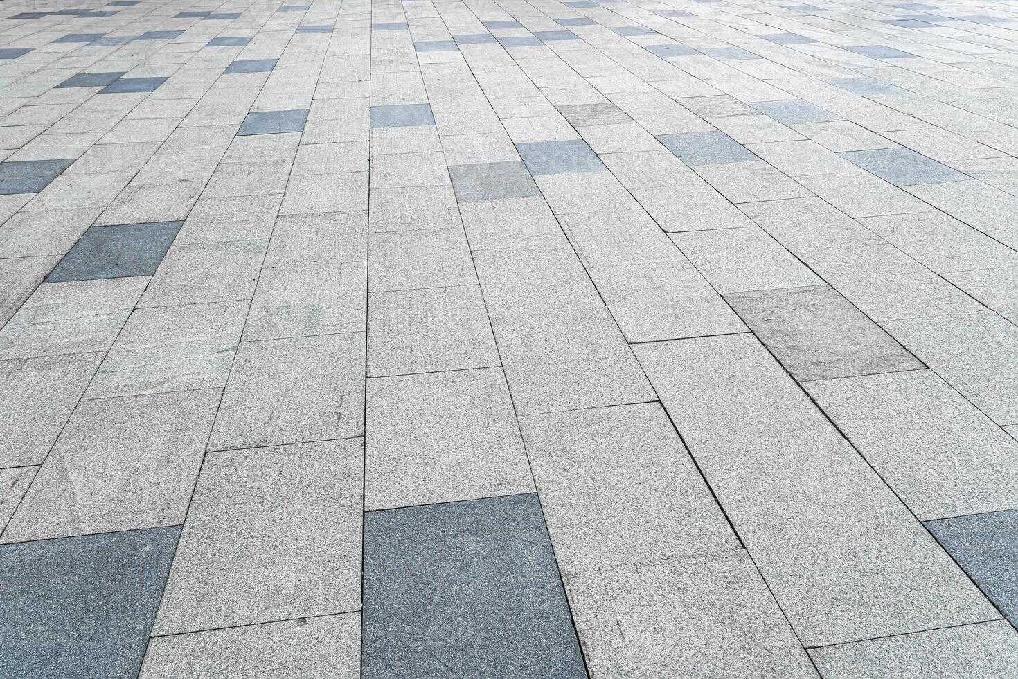 The texture of a tiled pavement with perspective. photo