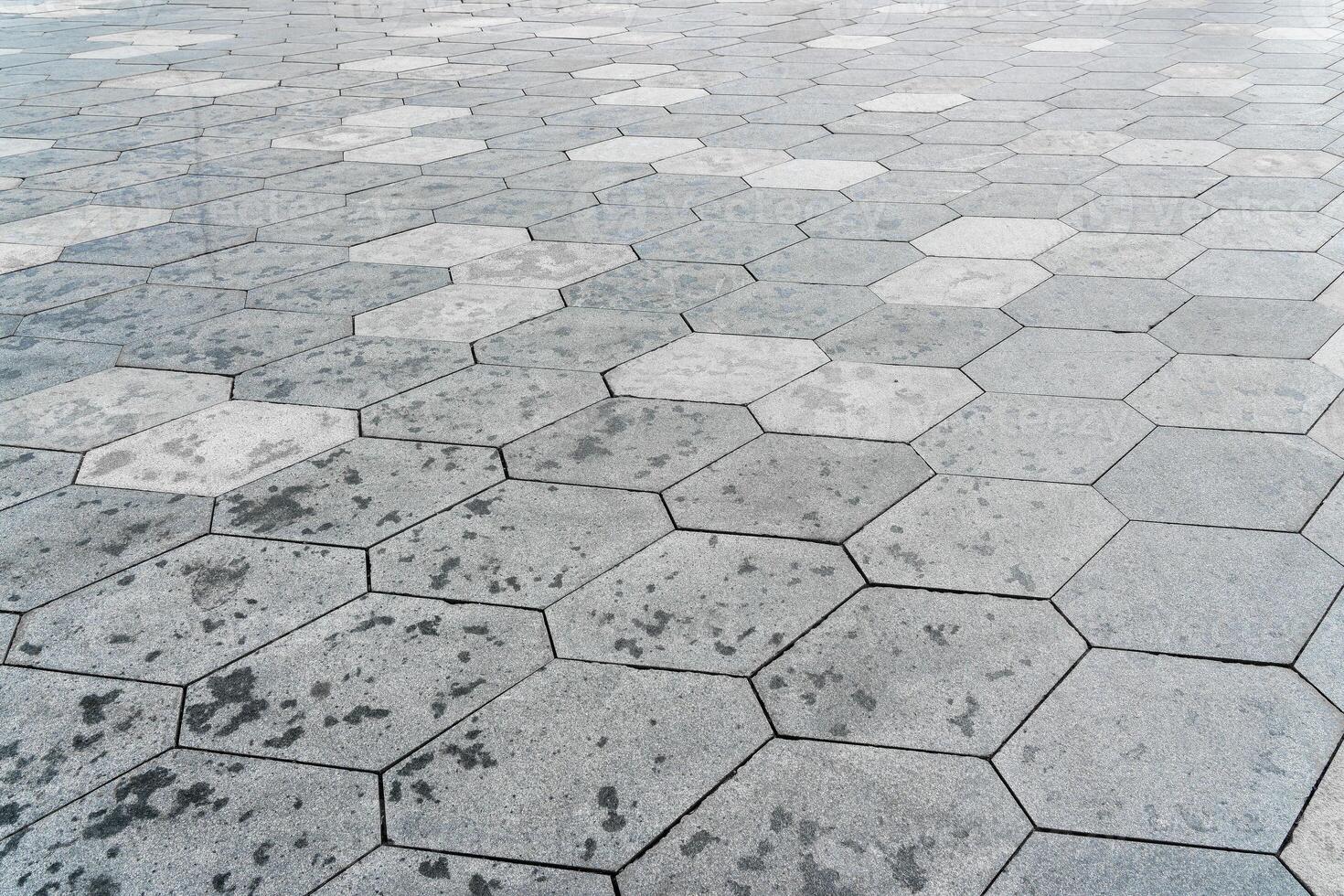 The texture of hexagonal tiled pavement with perspective. photo