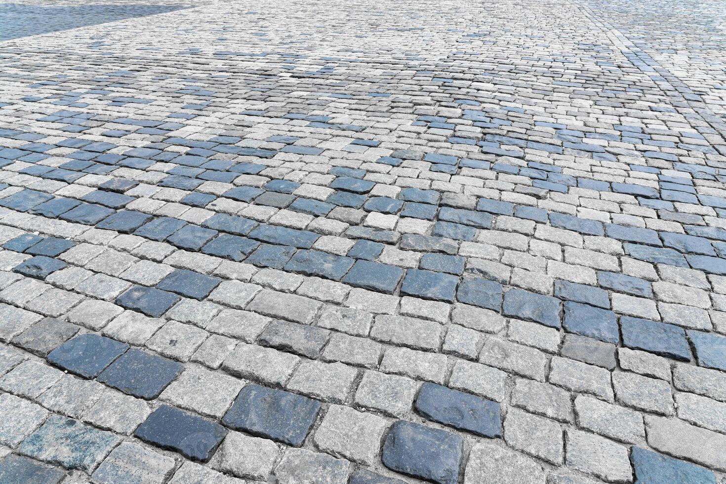 The texture of a stone old pavement with a perspective. photo