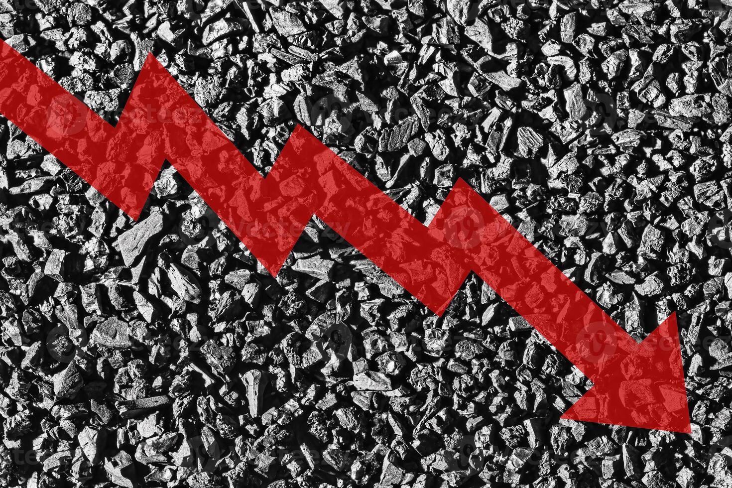 Arrow down on coal background. The concept of falling prices, mining, import, export, production or sales of coal. photo