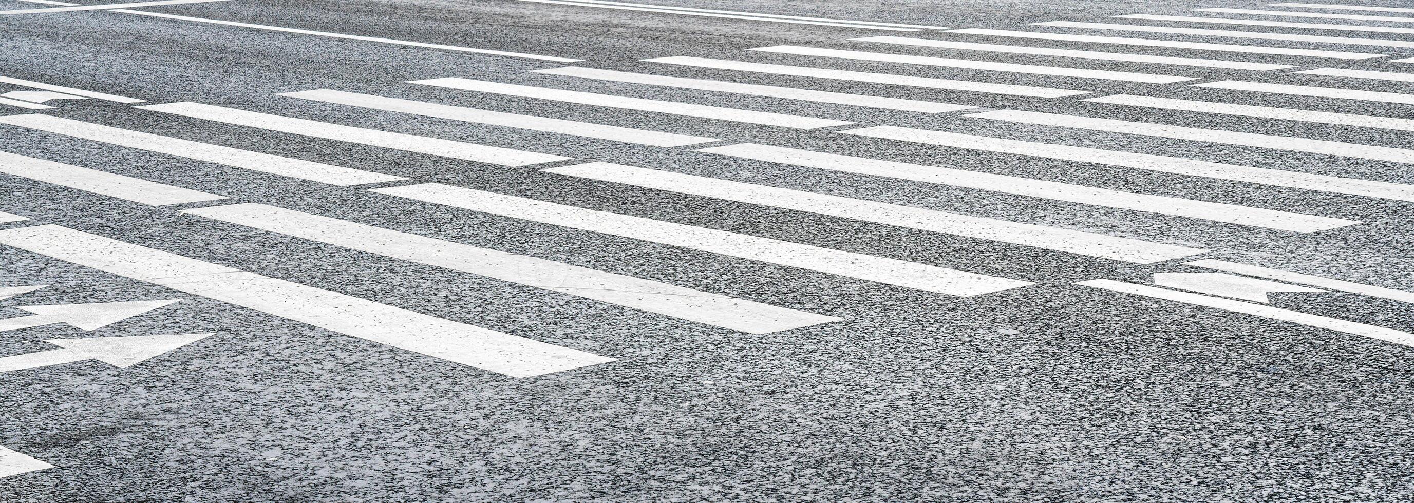 Crosswalk on the road background. Pedestrian crossing on an asphalt road. Crosswalk for safety. photo