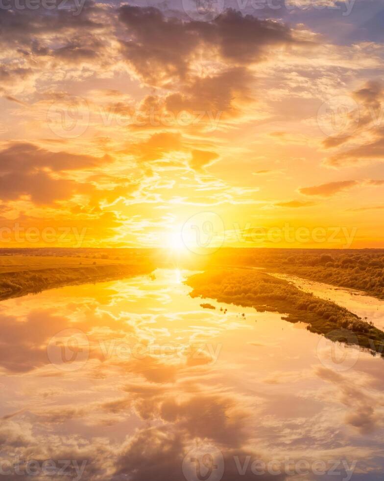 A sunset or sunrise a river with cloudy skies reflecting in the water. photo