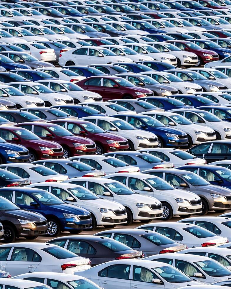 Volkswagen Group Rus, Russia, Kaluga - MAY 25, 2020 Rows of a new cars parked in a distribution center on a sunny day in the spring photo