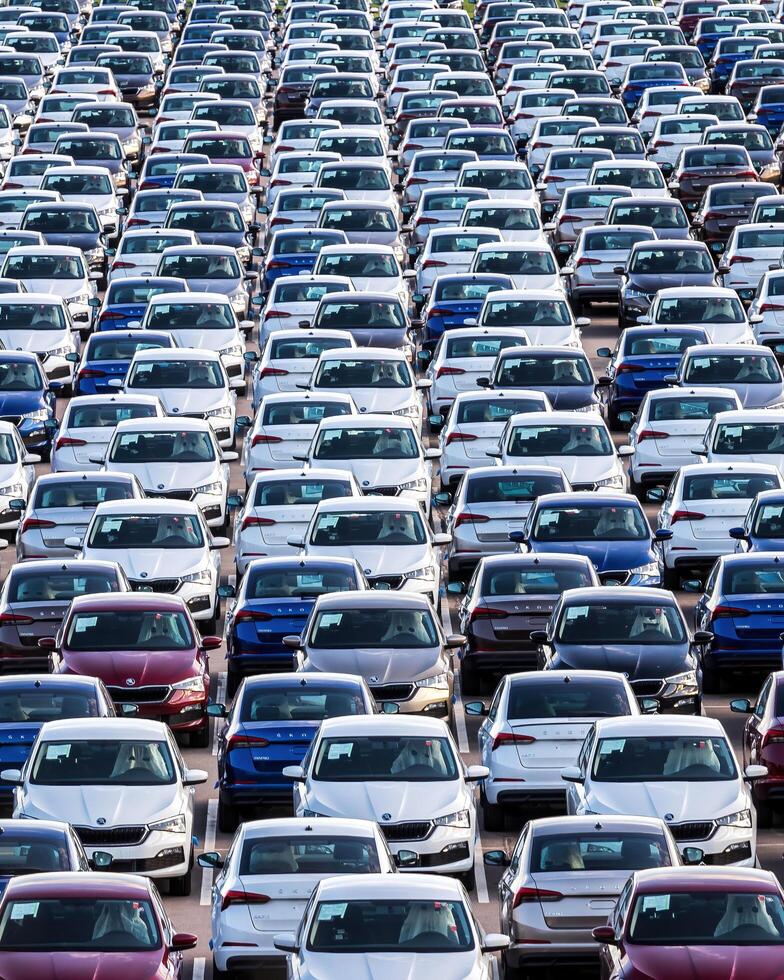 Volkswagen Group Rus, Russia, Kaluga - MAY 25, 2020 Rows of a new cars parked in a distribution center on a sunny day in the spring photo