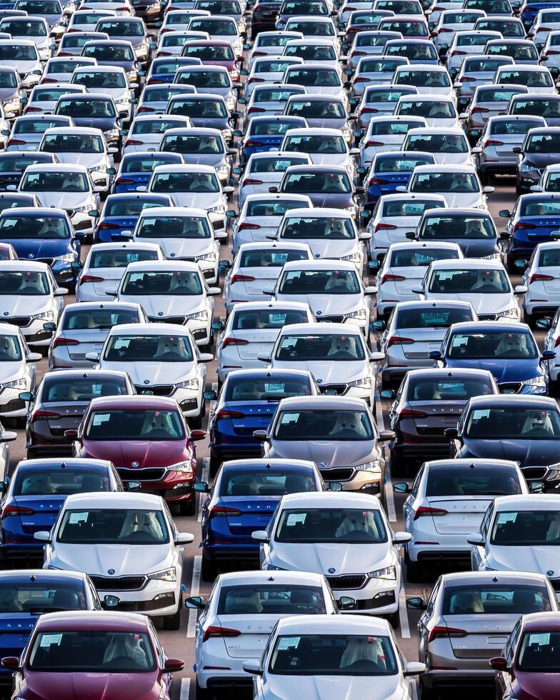 Volkswagen Group Rus, Russia, Kaluga - MAY 25, 2020 Rows of a new cars parked in a distribution center on a sunny day in the spring photo