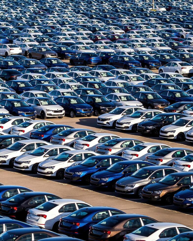 Volkswagen Group Rus, Russia, Kaluga - MAY 25, 2020 Rows of a new cars parked in a distribution center on a sunny day in the spring photo