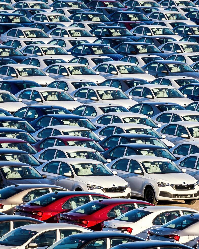 Volkswagen Group Rus, Russia, Kaluga - MAY 25, 2020 Rows of a new cars parked in a distribution center on a sunny day in the spring photo