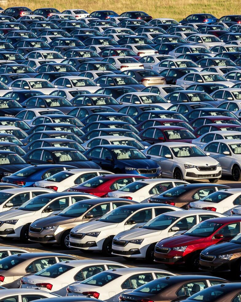 Volkswagen Group Rus, Russia, Kaluga - MAY 25, 2020 Rows of a new cars parked in a distribution center on a sunny day in the spring photo