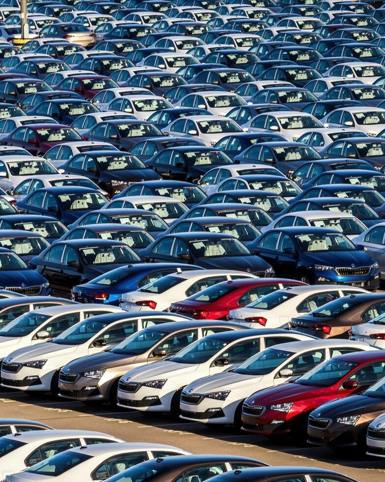 Volkswagen Group Rus, Russia, Kaluga - MAY 25, 2020 Rows of a new cars parked in a distribution center on a sunny day in the spring photo
