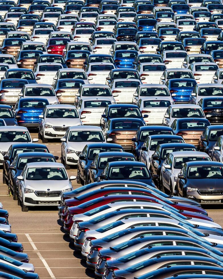 Volkswagen Group Rus, Russia, Kaluga - MAY 25, 2020 Rows of a new cars parked in a distribution center on a sunny day in the spring photo