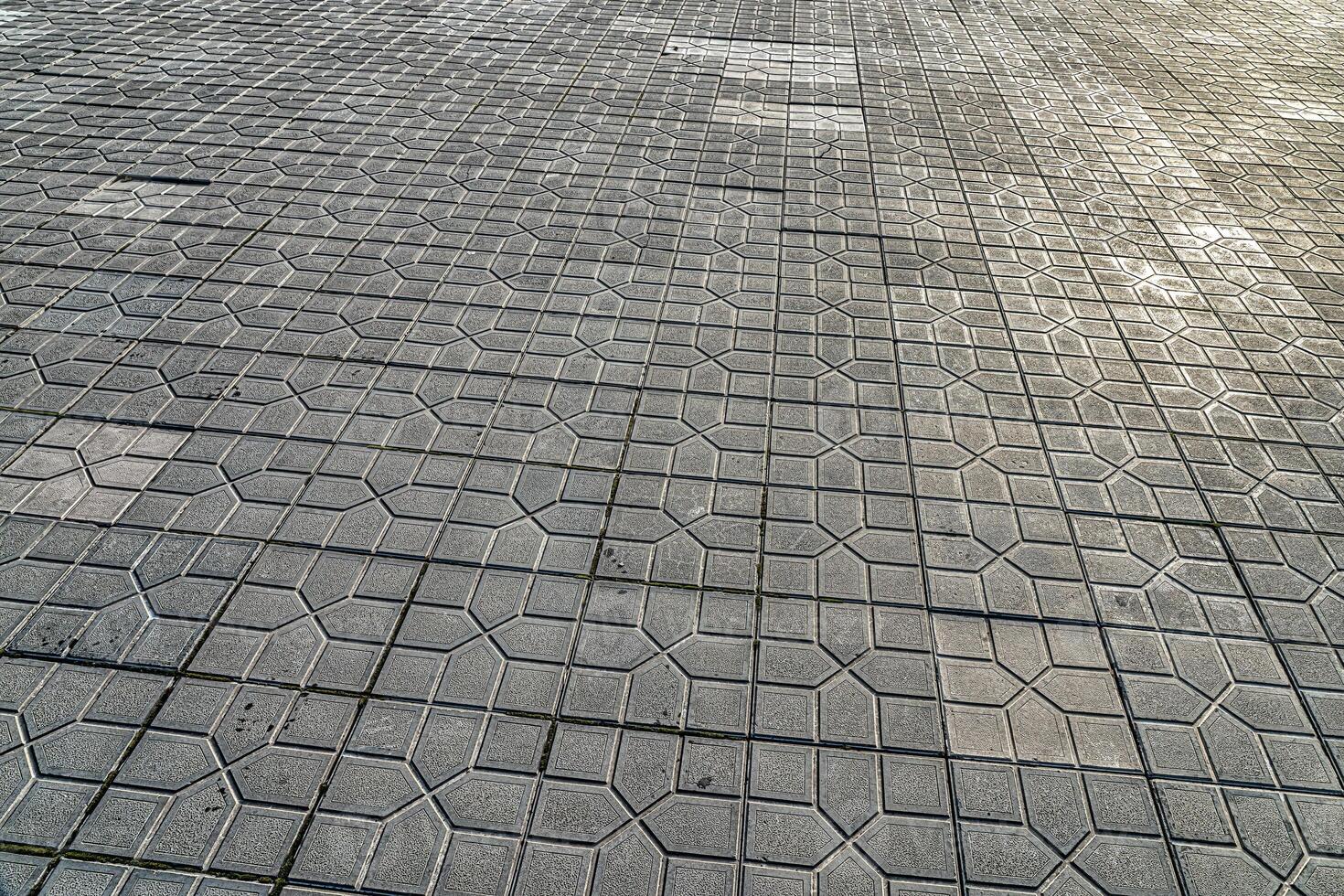 The texture of a tiled pavement with perspective. photo