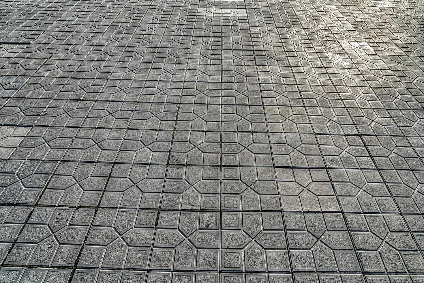 The texture of a tiled pavement with perspective. photo