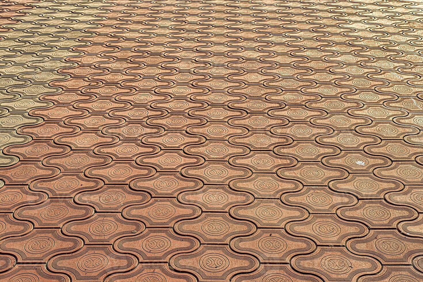 The texture of a tiled pavement with perspective. photo