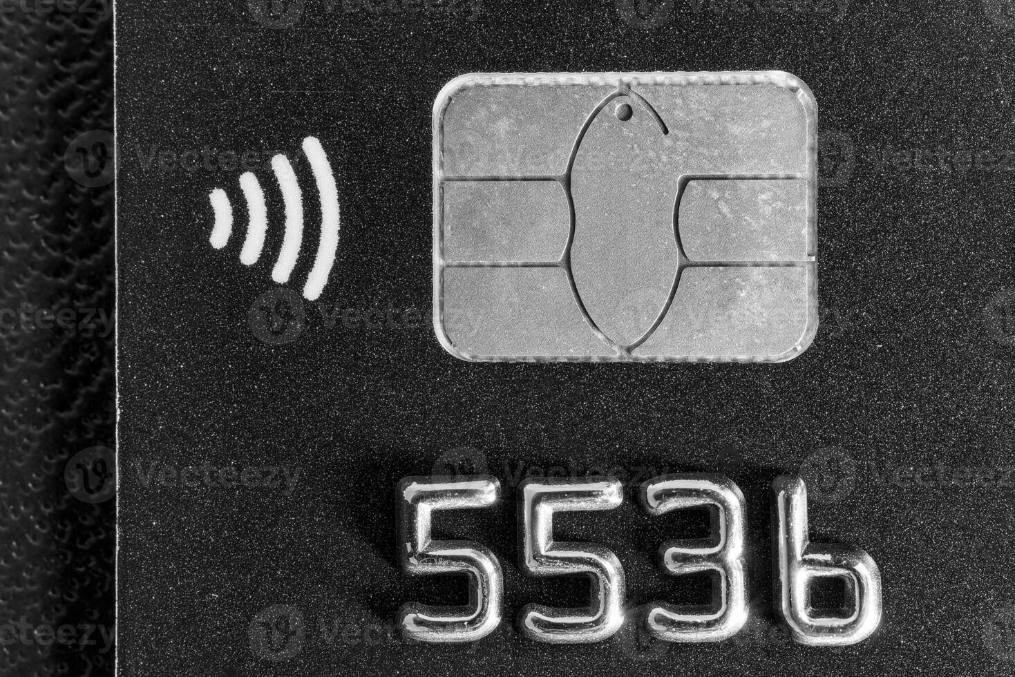 Close-up shot of a debit or credit card with a chip. photo
