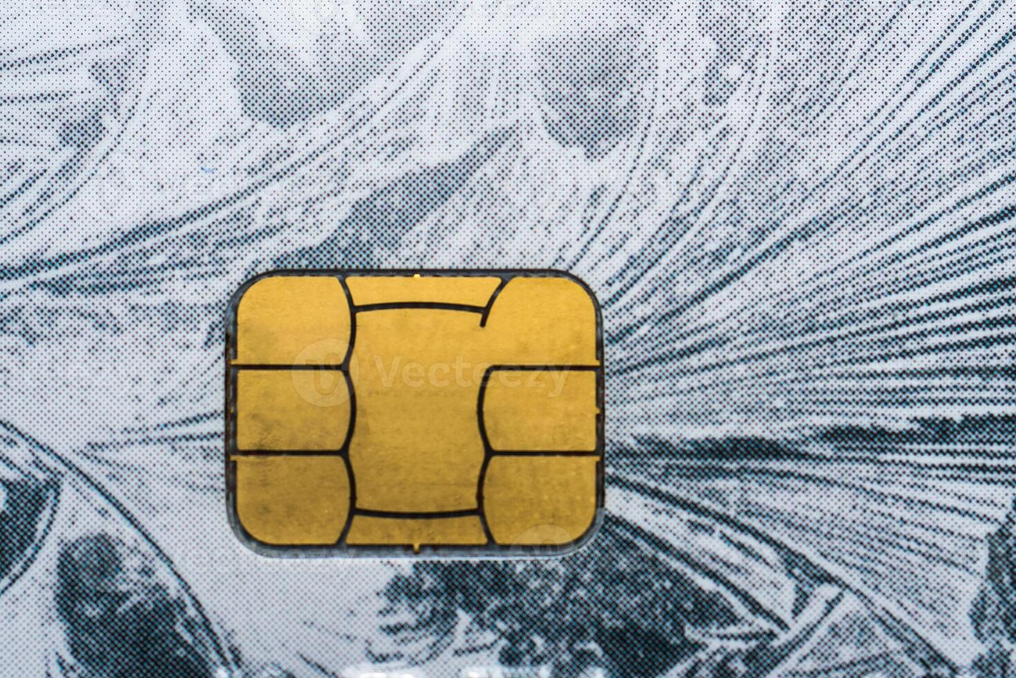 Close-up shot of a debit or credit card with a chip. photo