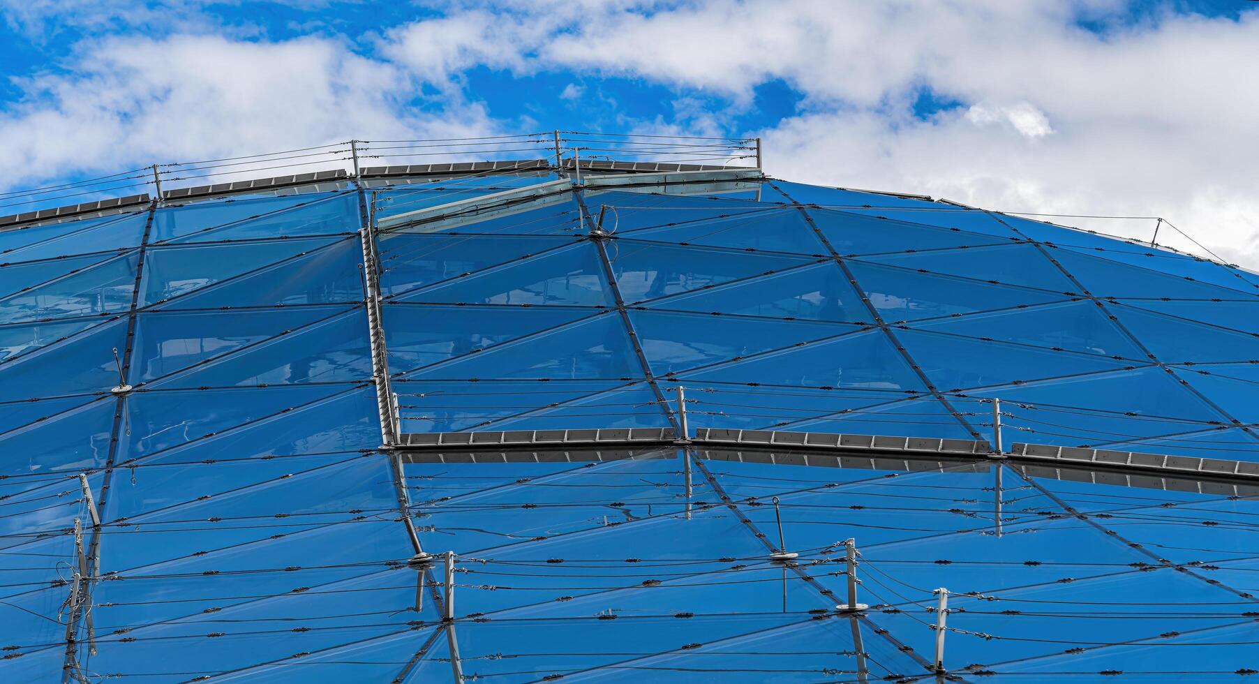 Moscow, Russia - JULY 16, 2022 Glass metal framed roof of a modern building in Moscow Zaryadye park. Abstract background. photo