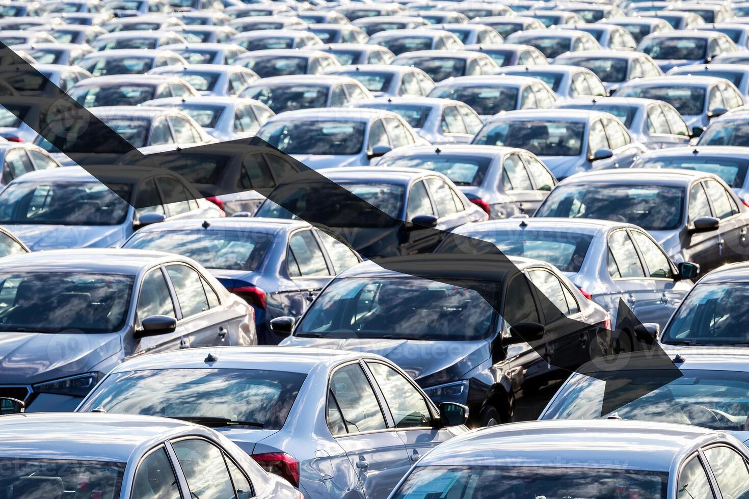 The concept of a decline in car production or prices. Manufacturing crisis or recession crisis in new car sales. photo