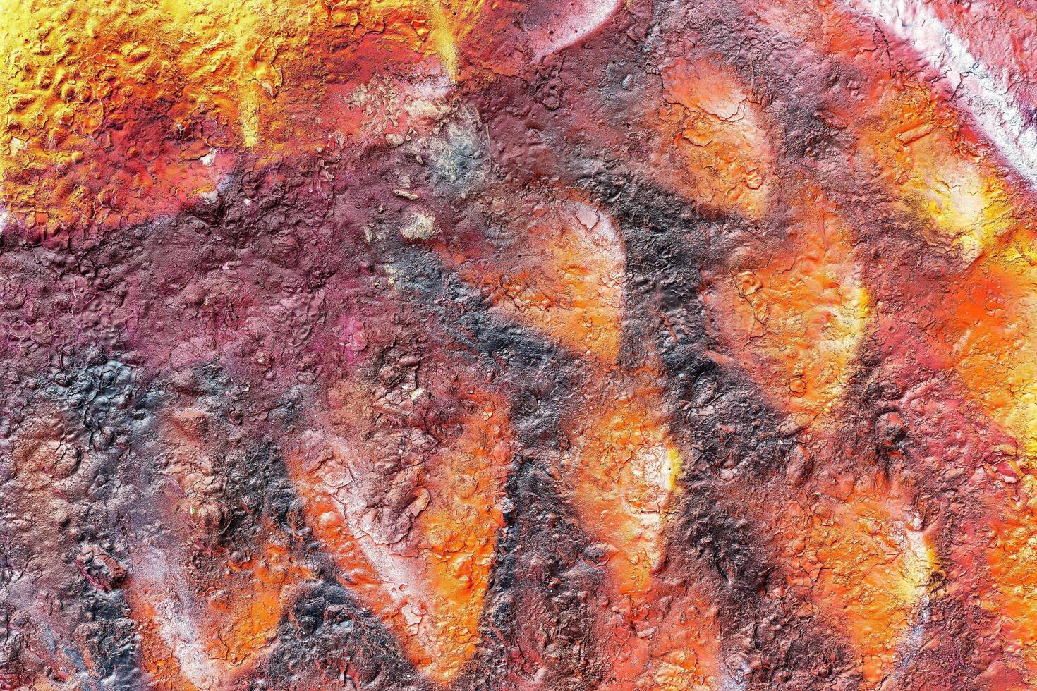 Colorful graffiti painted on a wall. Abstract urban background. Spray painting art. photo