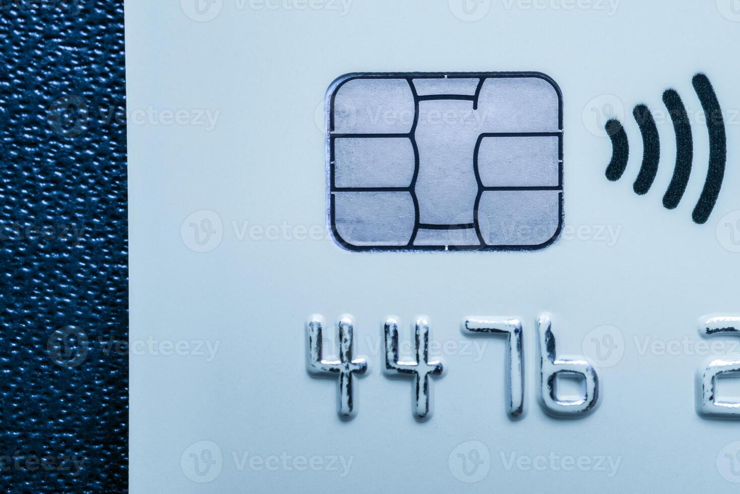 Close-up shot of a debit or credit card with a chip. photo