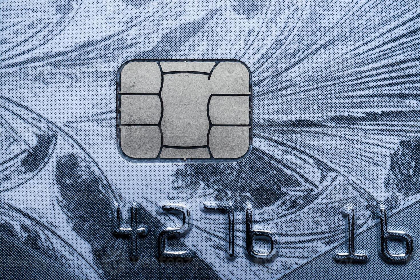 Close-up shot of a debit or credit card with a chip. photo