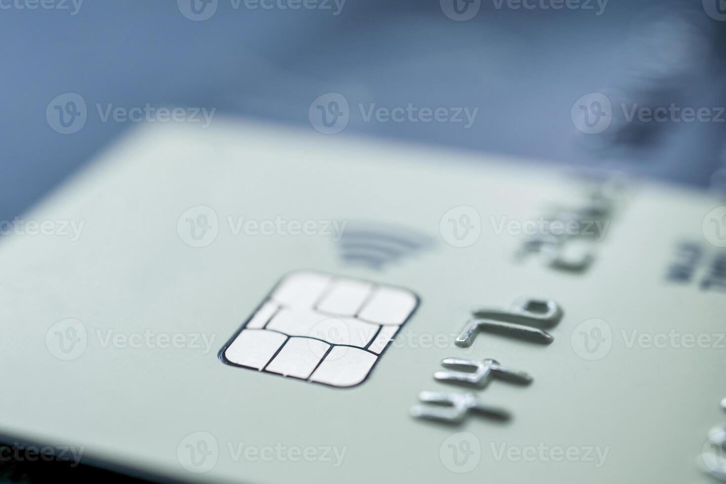 Close-up shot of a debit or credit card with a chip. photo