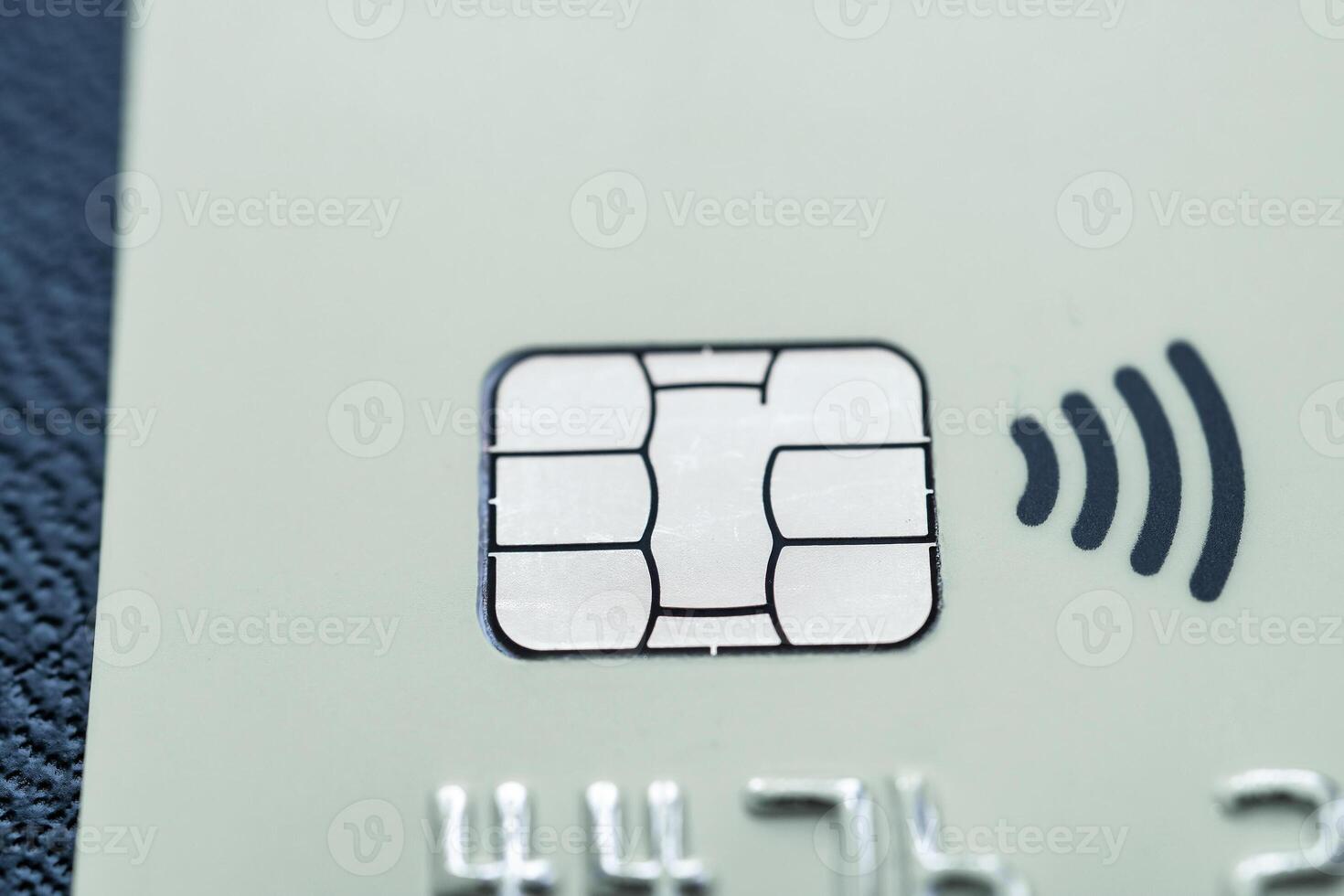 Close-up shot of a debit or credit card with a chip. photo