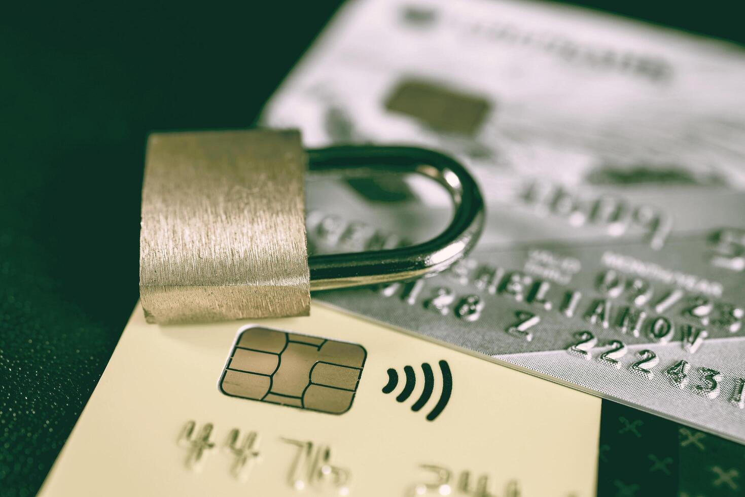 Russia, Kaluga - JULY 11, 2022 Debit or credit card with lock. The concept of security, protection or blocking of funds on the card. photo
