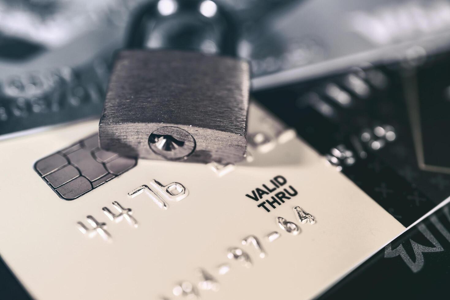 Russia, Kaluga - JULY 11, 2022 Debit or credit card with lock. The concept of security, protection or blocking of funds on the card. photo