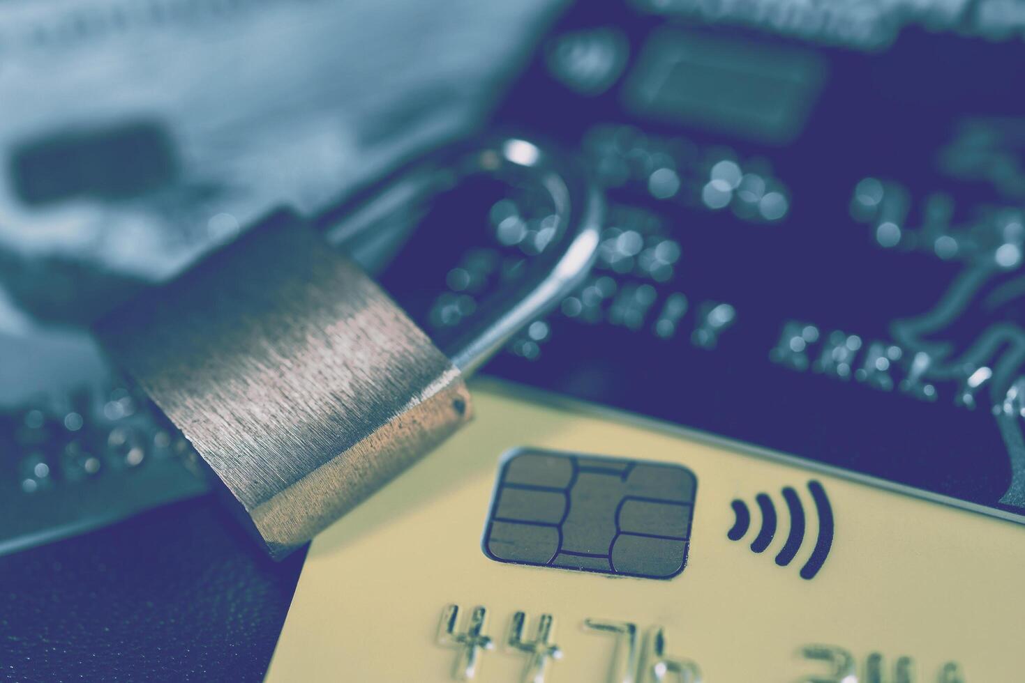 Russia, Kaluga - JULY 11, 2022 Debit or credit card with lock. The concept of security, protection or blocking of funds on the card. photo