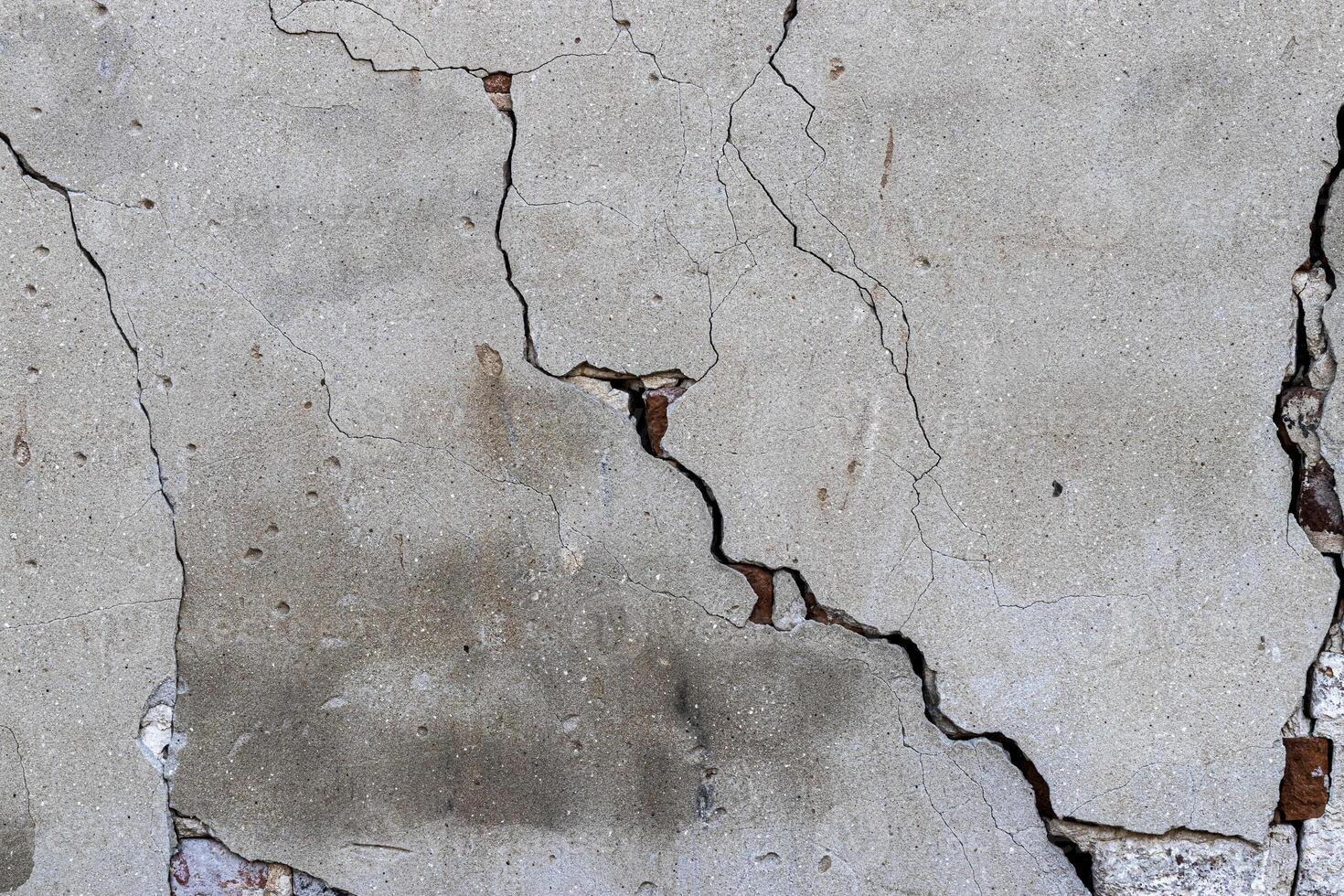 Texture of a concrete wall with a crack. photo