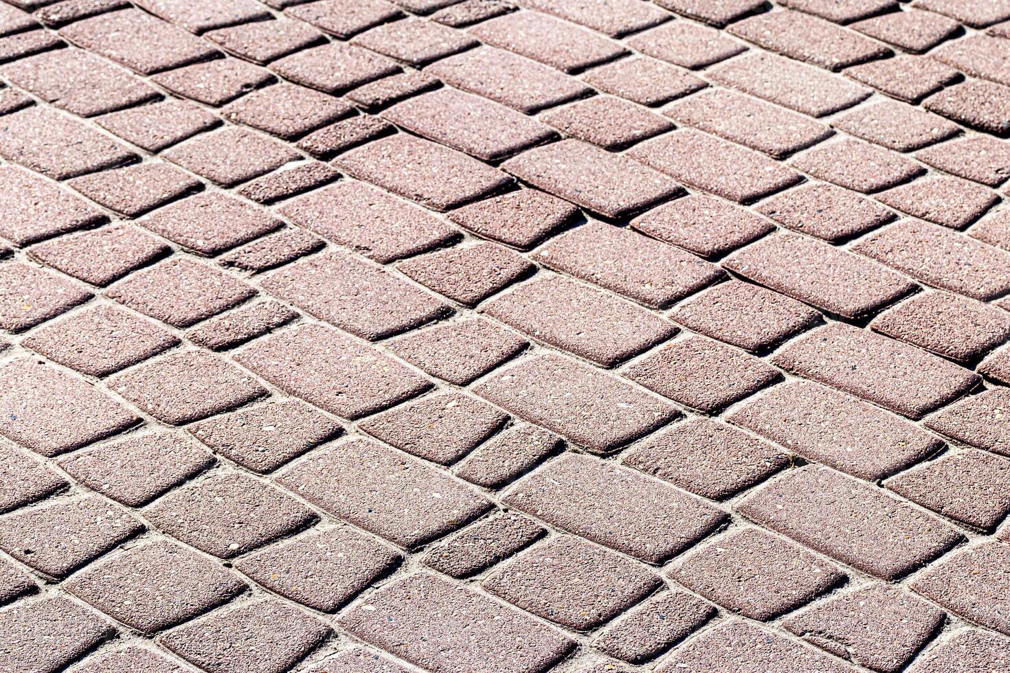 Texture of a paving stone road. Abstract background for design. photo