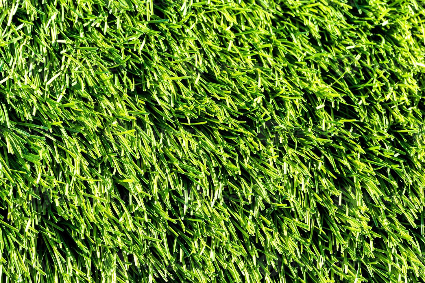 Artificial green grass or needles texture. photo