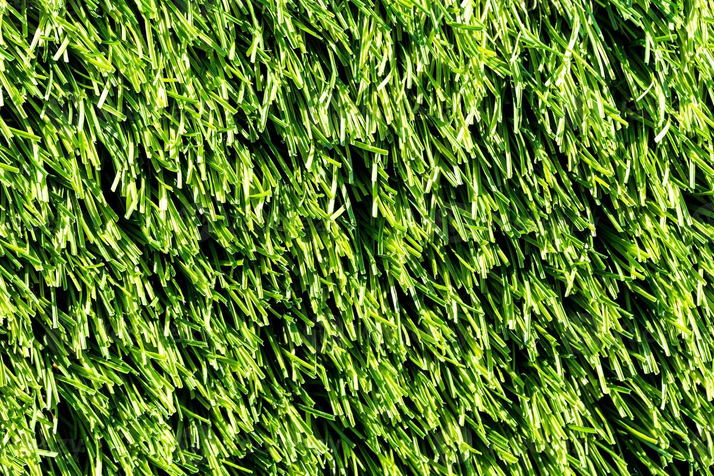Artificial green grass or needles texture. photo