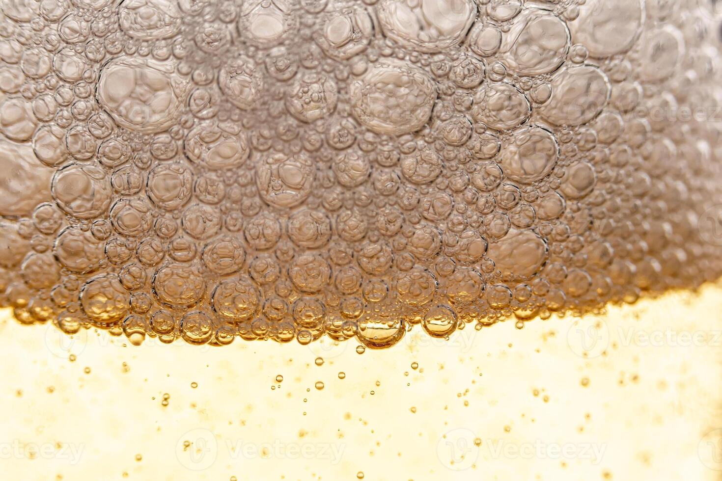 Texture of gas bubbles in light beer. photo