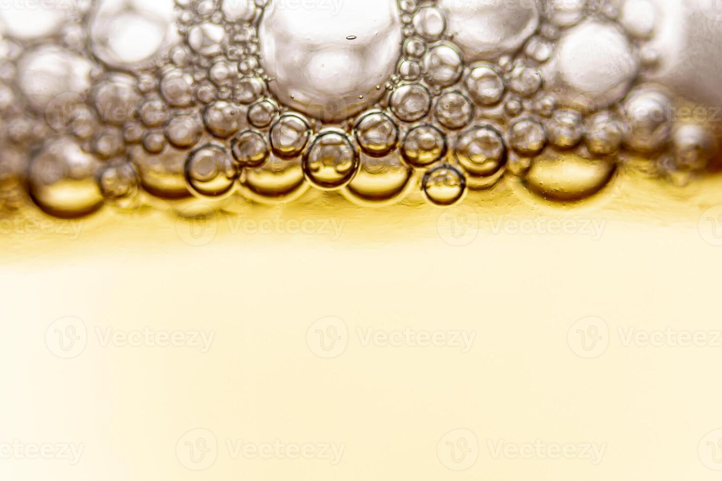 Texture of gas bubbles in light beer. photo