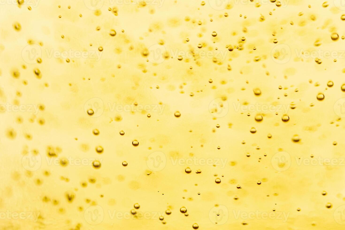 Texture of gas bubbles in light beer. photo