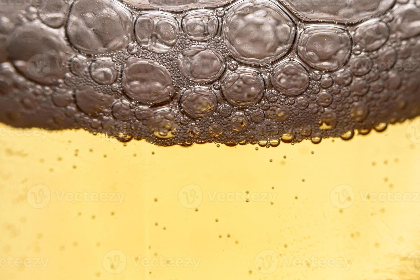 Texture of gas bubbles in light beer. photo