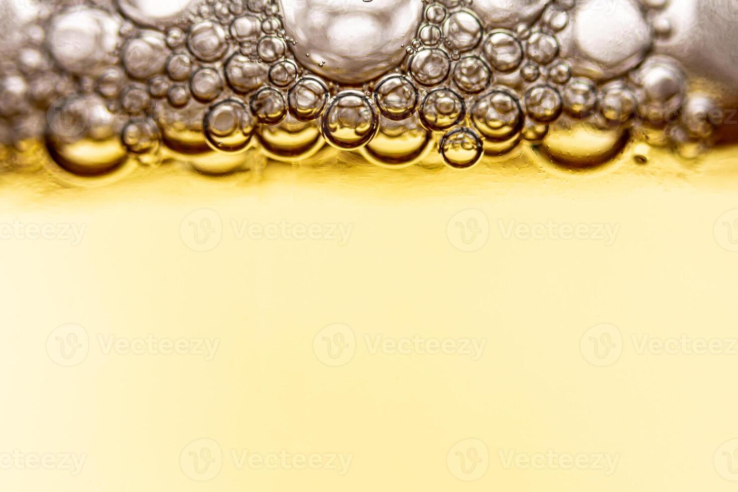 Texture of gas bubbles in light beer. photo