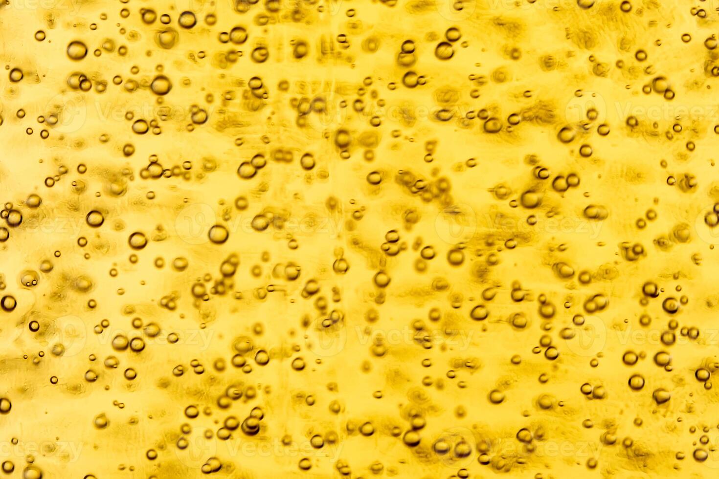 Texture of gas bubbles in light beer. photo